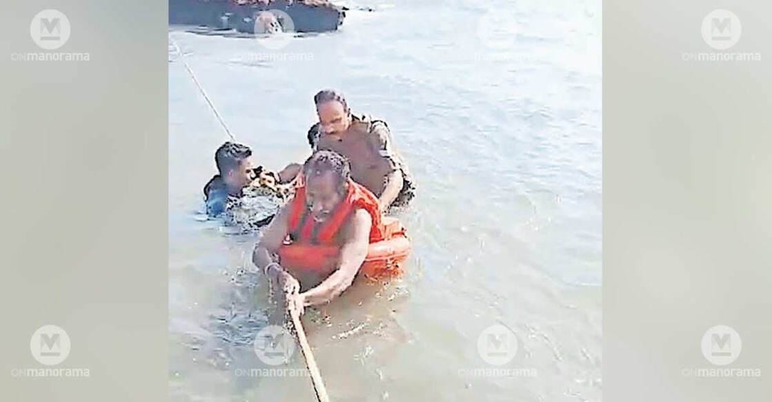 Fire and Rescue Service personnel rescue Malay Bhadra, a native of Bengal, who was stranded in the sea near Manakkadweep, Koduvally in Kannur. Photo: Special arrangement