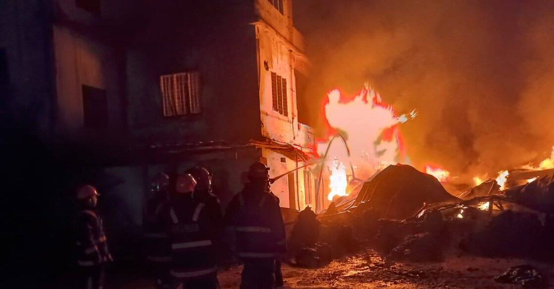 Firefighters attempting to douse the fire. Photo: Special Arrangement.