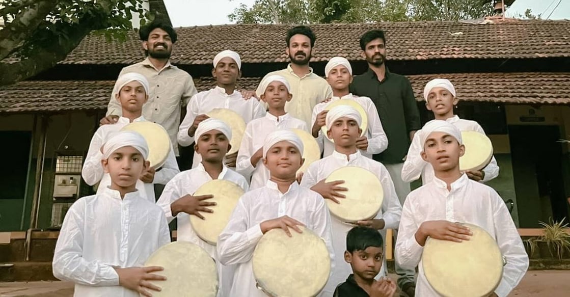Ahammed Shibiyaan K P with his Arabanamuttu group dance team from CHM High School, Pookolathur in Malappuram. Photo: Special Arrangement. 