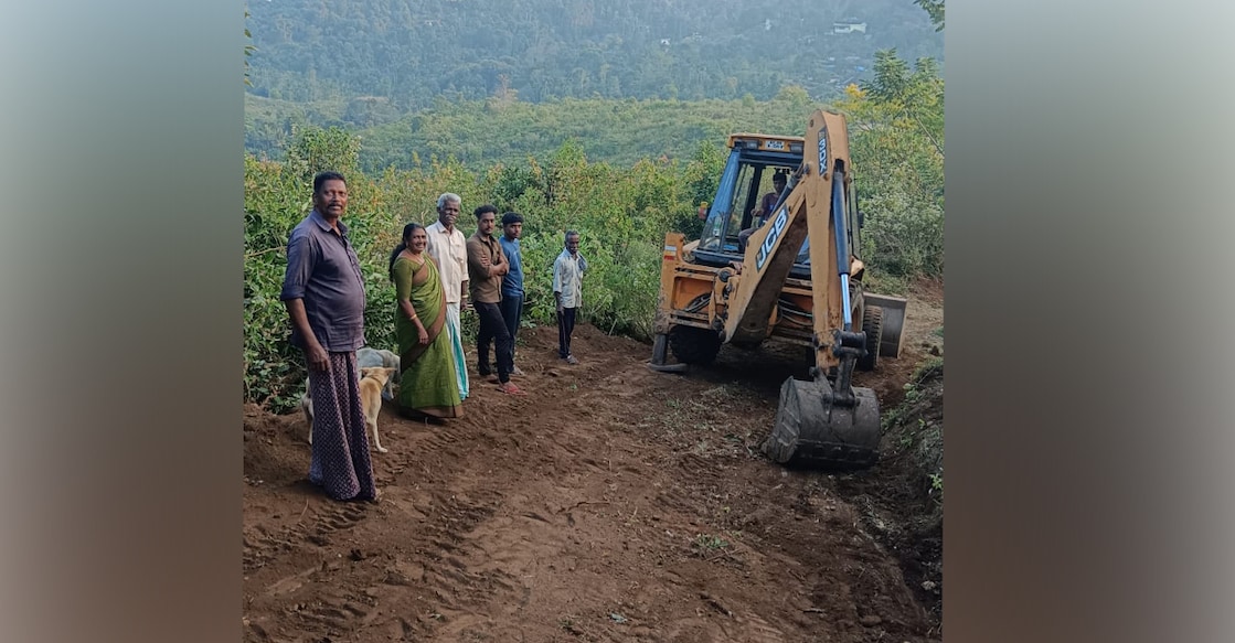 Jabakani (second from left) observing the church road construction. Photo: Special arrangement