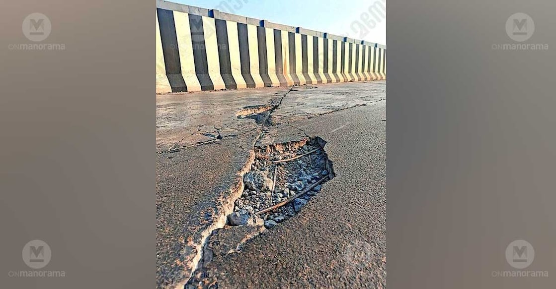 A pothole with exposed iron rods on the Chengolappadam railway overbridge in Mulanthuruthy. Photo: Special arrangement