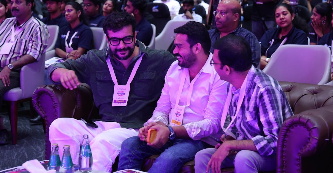 Actor Ramesh Pisharody and Dr Tom Joseph, Director – New Initiatives at Jain (Deemed-to-be University), sharing a light moment at the Summit of the Future 2026 held at Kochi. Photo: Special Arrangement