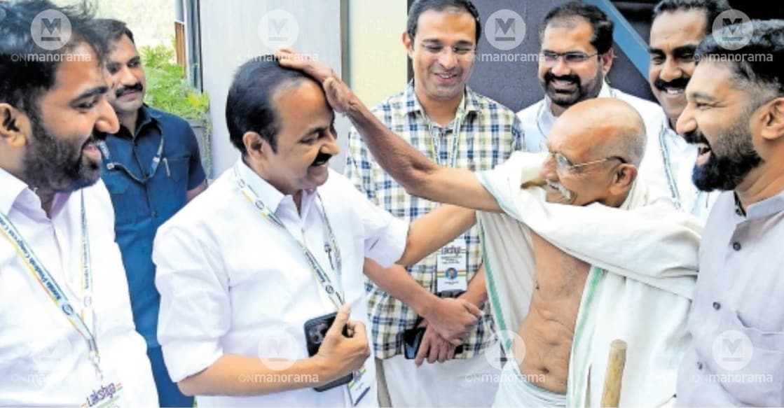 A man dressed as Mahatma Gandhi blesses VD Satheesan at the Congress leaders’ camp in Wayanad. Photo: Manorama