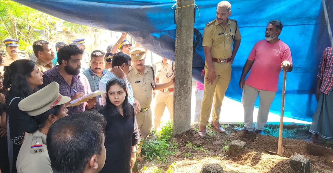 Police and authorities exhuming the body of the infant. Photo: Special arrangement