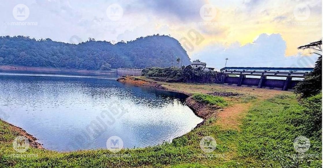 The Aanathode dam of the Sabarigiri hydroelectric project, with its water level currently at 61 percent. Grass has grown around the dam's spillway gates. Photo: Special arrangement
