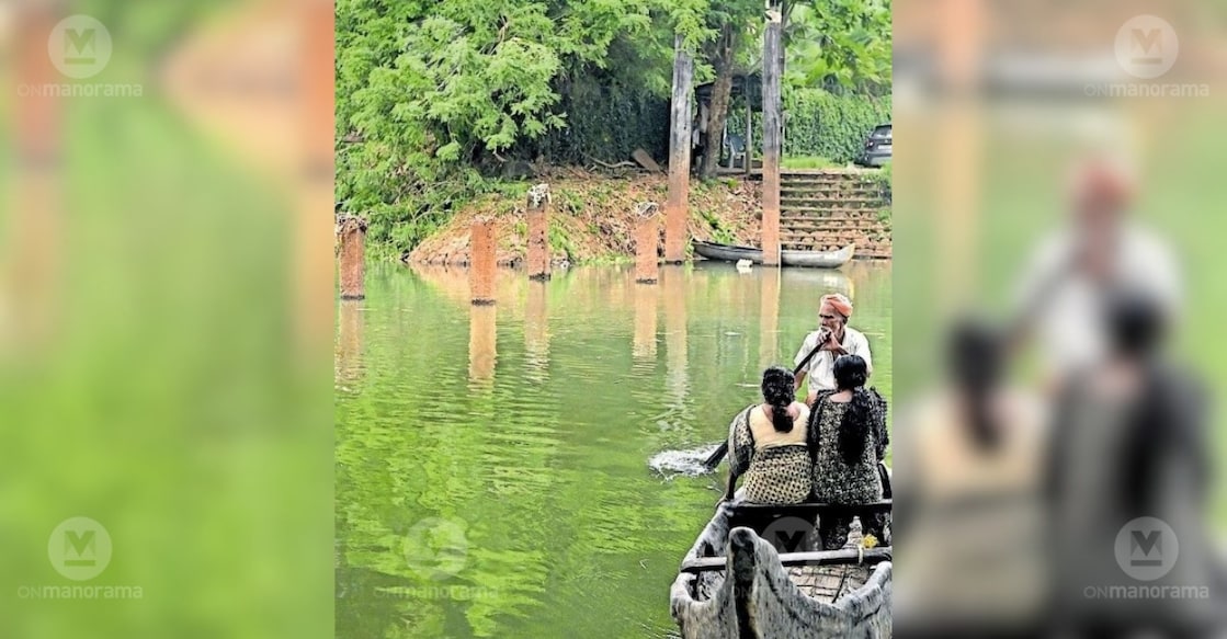 People cross the Meenachil river in a country boat at Idakkattu near Kottayam. Photo: Special Arrangement.
