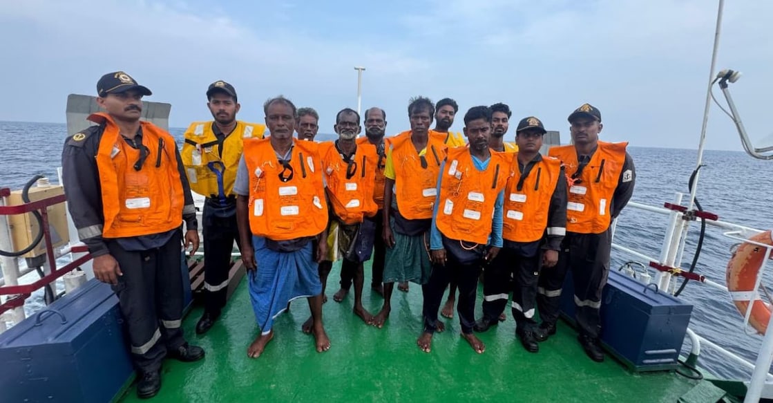 Crew members of the dhow Jesus Heart with their rescuers. Photo: Special Arrangement