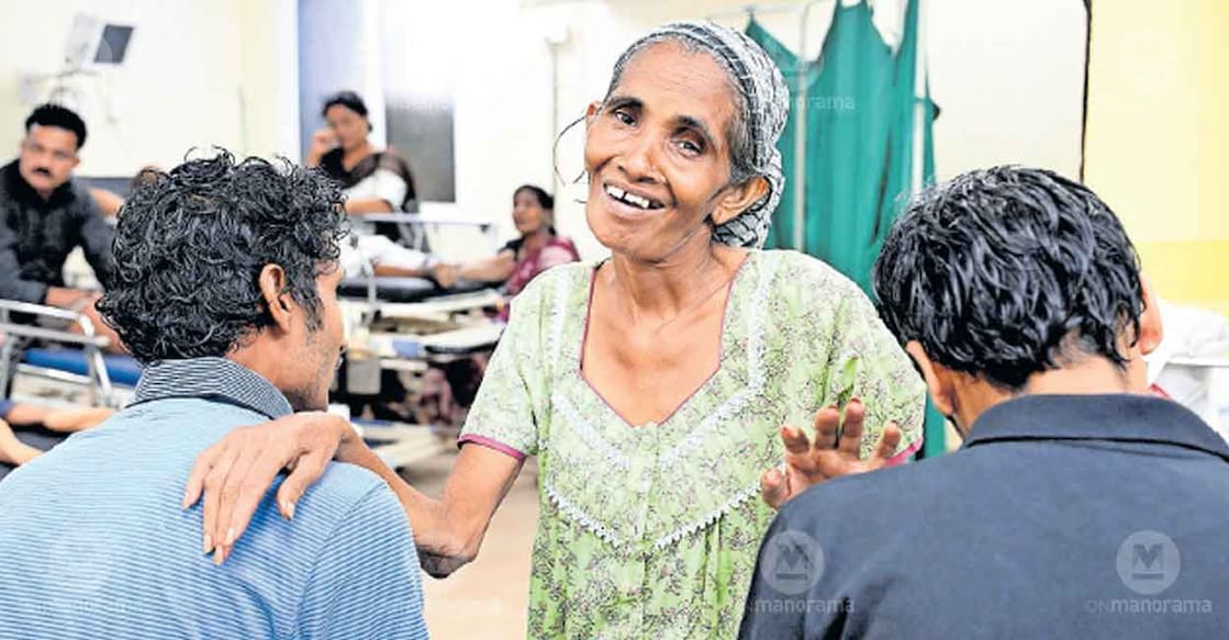 Usha and her sons at Pariyaram Government Medical College Hospital after they were given a bath and fresh clothes.  Photo: Malayala Manorama