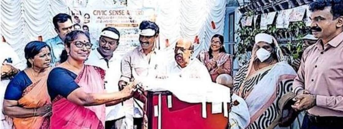 MLA G. Sudhakaran presents a refrigerator to Vibha, the winner of a competition organized by the Purakkad Community Health Centre for maintaining cleanliness in her home and surroundings. Photo: Special Arrangement