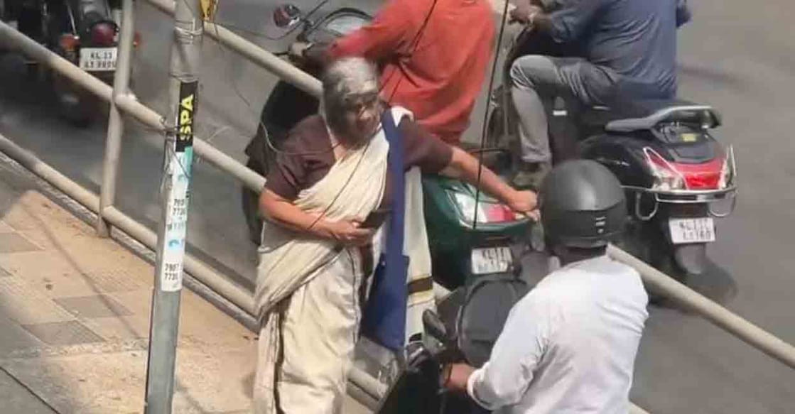 An elderly woman in Kozhikode single-handedly stopped a scooter rider from illegally using a footpath to bypass a traffic signal. Photo: Special arrangement