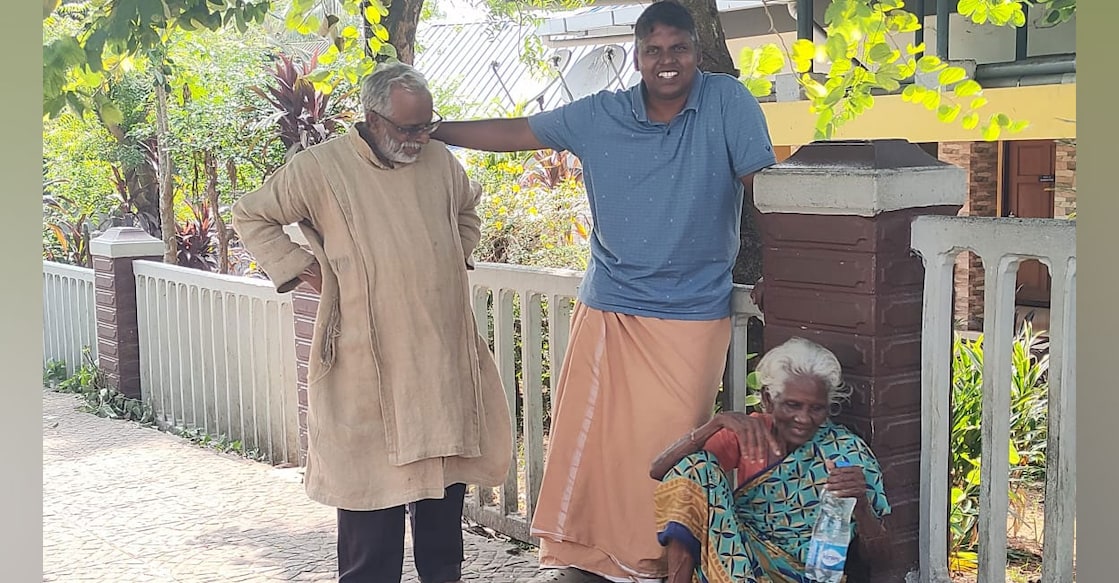 Jose Njaliyath (62) with people on the street. Photo: Special Arrangement