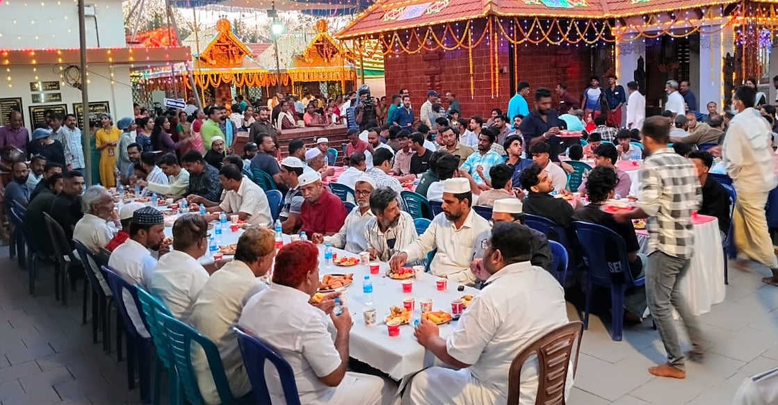Iftar in the courtyard of the Sree Poobanam Kuzhi Temple at Thachangad in Panayal village near Bekal. Photo: Special Arrangement