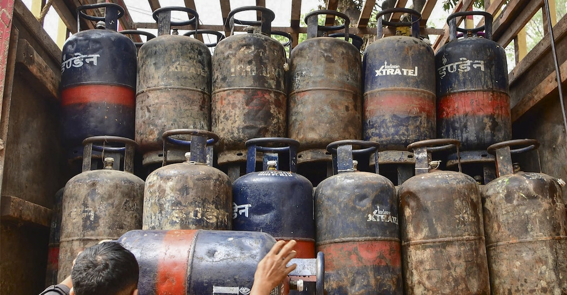 A worker off-loads LPG cylinders from a carrier truck, in Guwahati, Assam, Wednesday, March 11, 2026. Photo: PTI