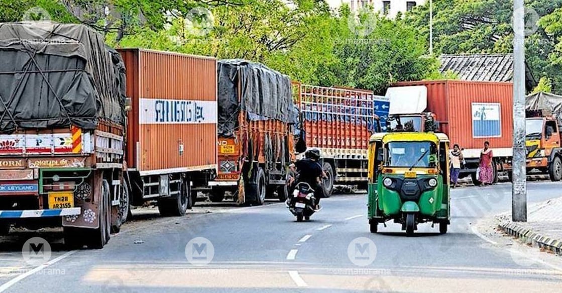 A view of trucks parked along one side of Udayanagar Road in Kadavanthra. 