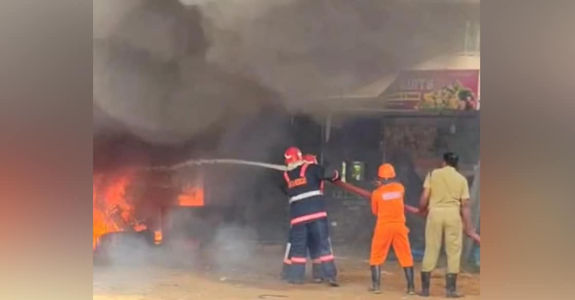 The fire force trying to contain the blaze at the fruit godown in Vandur. Photo: Special arrangement