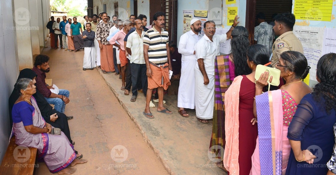 Voters standing in the queue to vote at Kanhangad Fisheries School in Kasaragod. Photo: Manorama
