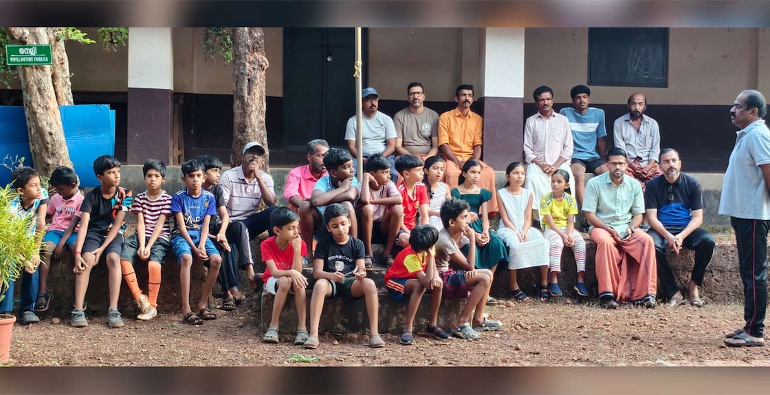 Children and parents resting after 'Thanal Nadatha' and listening to the trainers of 'Be Fit' camp. Photo: Special arrangement 