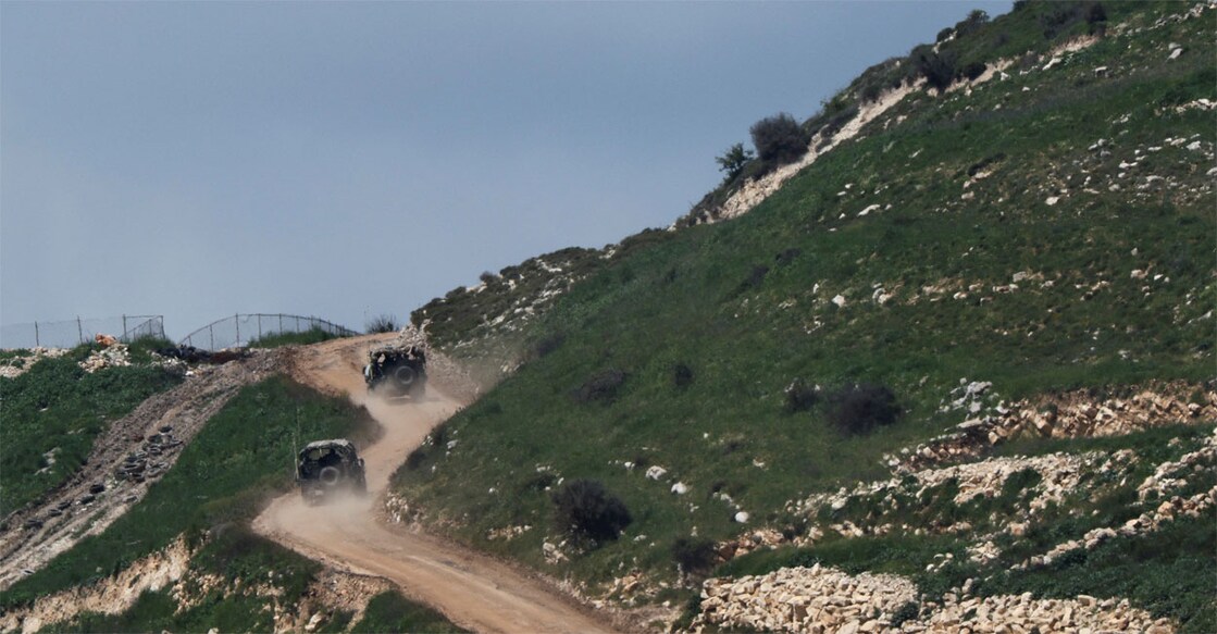 Military vehicles manoeuvre in Lebanon, as seen from the Israeli side of the border, in northern Israel, April 10, 2026. Photo: Amir Cohen/Reuters