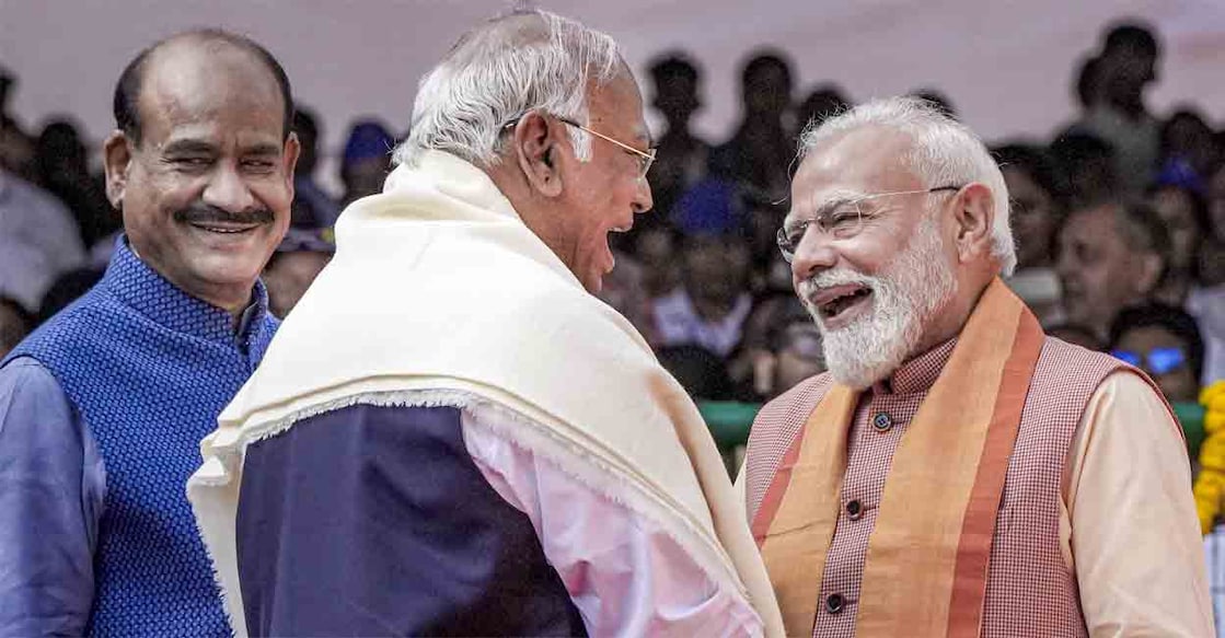Prime Minister Narendra Modi exchanges greetings with Congress President and Rajya Sabha LoP Mallikarjun Kharge during the tribute paying ceremony to Dr BR Ambedkar on his birth anniversary. Lok Sabha Speaker Om Birla is also present. Photo: PTI
