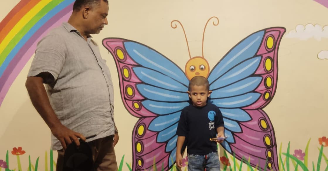 Adam with his grandfather, Raheem Babu. Photo: Special Arrangement.