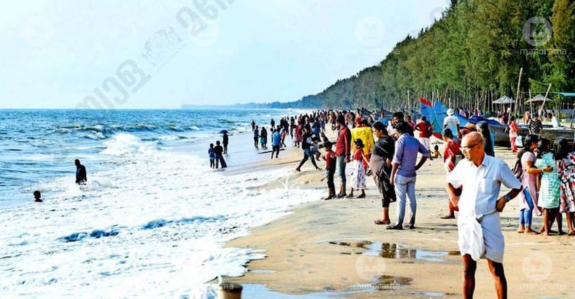Visitors enjoying the sea at Kuzhuppilly Beach. Photo: Special arrangement