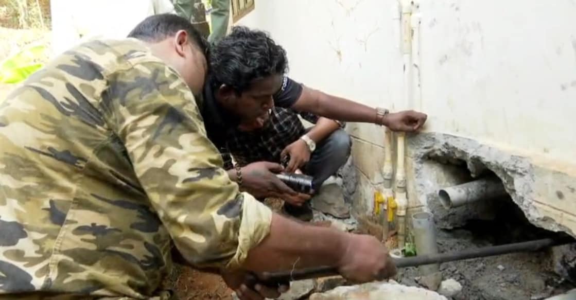 Officials of the Forest Department conducting a search for snakes at the house of Aljo. Photo: Special arrangement