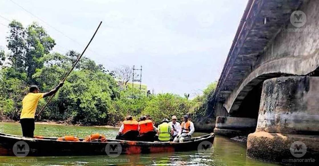 The experts' team in a canoe inspecting the weak areas of the bridge and the marshy spot, which has been covered with soil. Photo: Special arrangement
