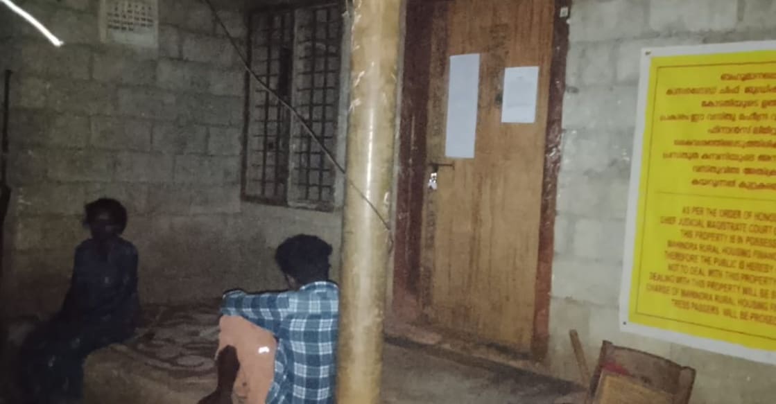 Sindhu lays out a mat in the sitout to sleep at Kottakunnu Unnathi in Kadumeni ward in East Eleri panchayat Tuesday night. Photo: Special Arrangement