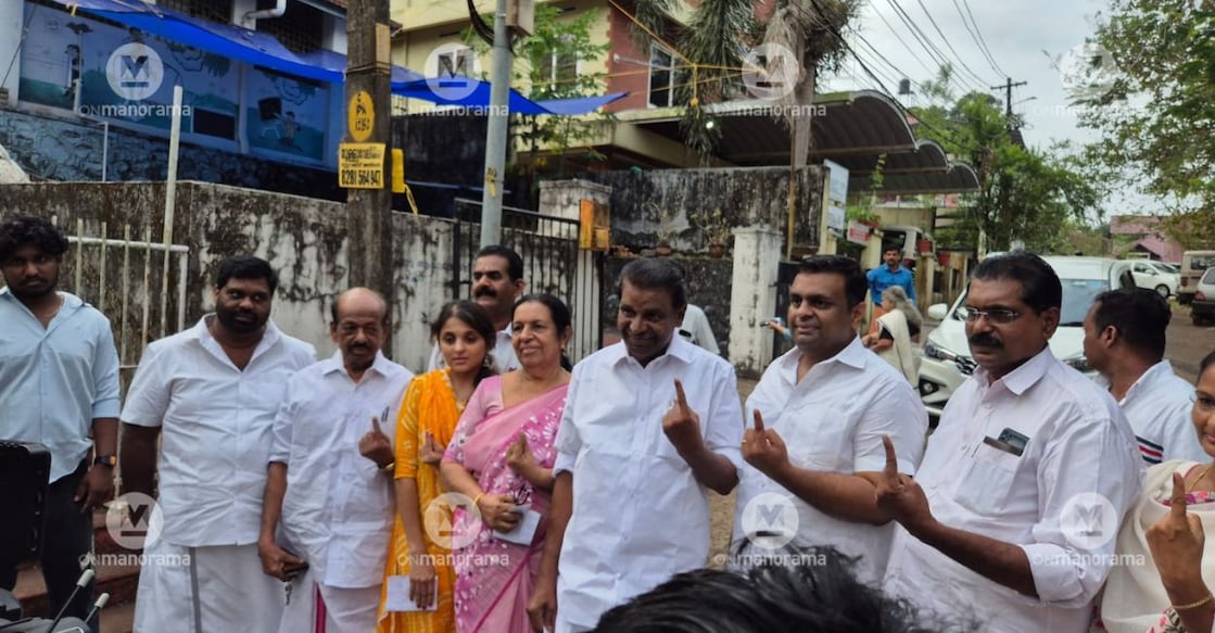 Thiruvanchoor Radhakrishnan with his family after casting his vote. Photo: Onmanorama