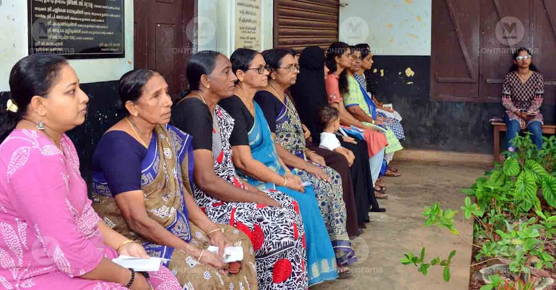 Women wait outside polling booth in Kerala during assembly elections on April 9, 2026. Photo: Manorama