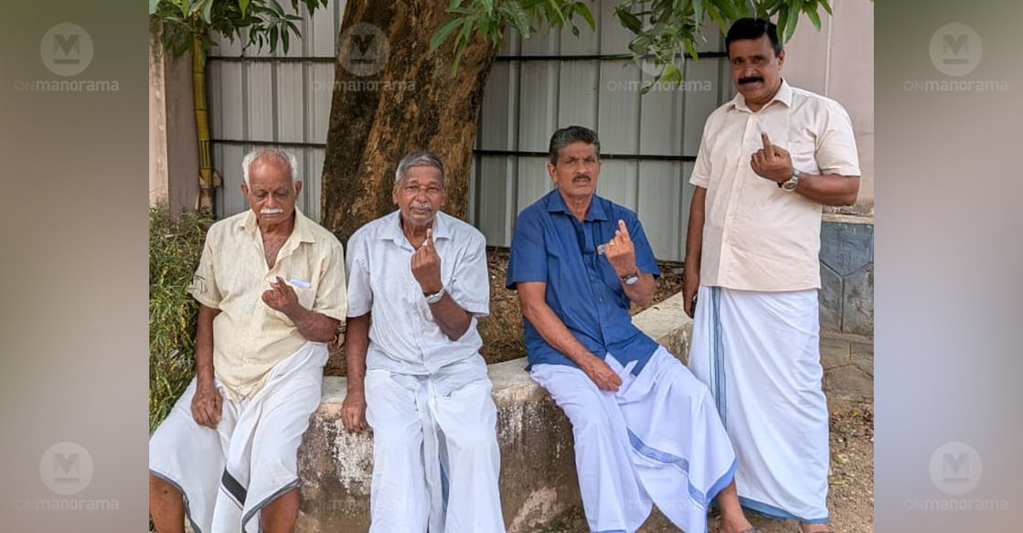 Voters in Vempally showing their index finger after casting their votes. Photo: Onmanorama