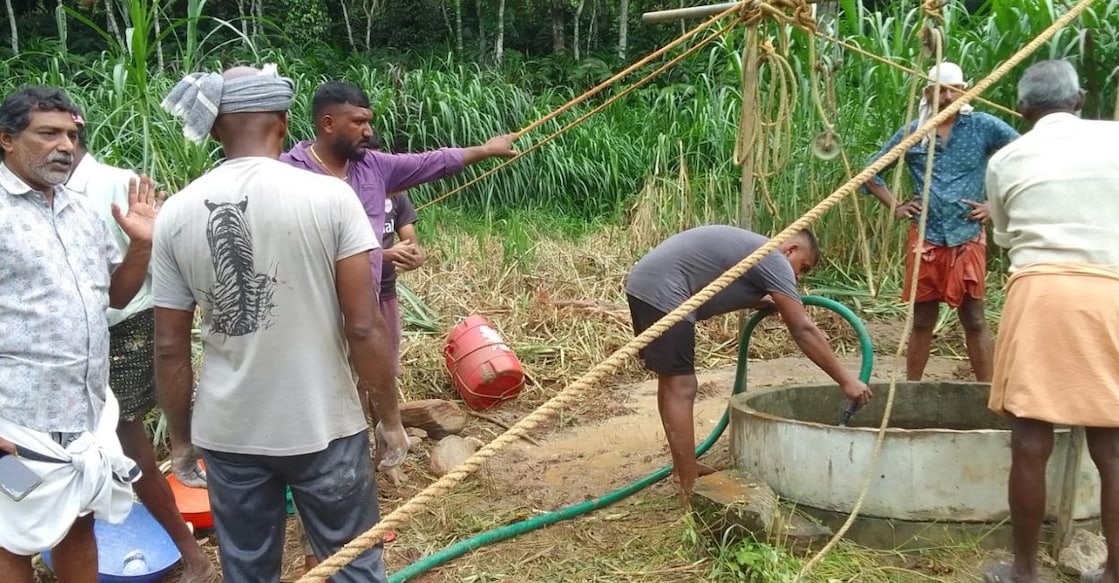 Fire and Rescue personnel rescuing the trapped youth and goat from the well. Photo: Special Arrangement
