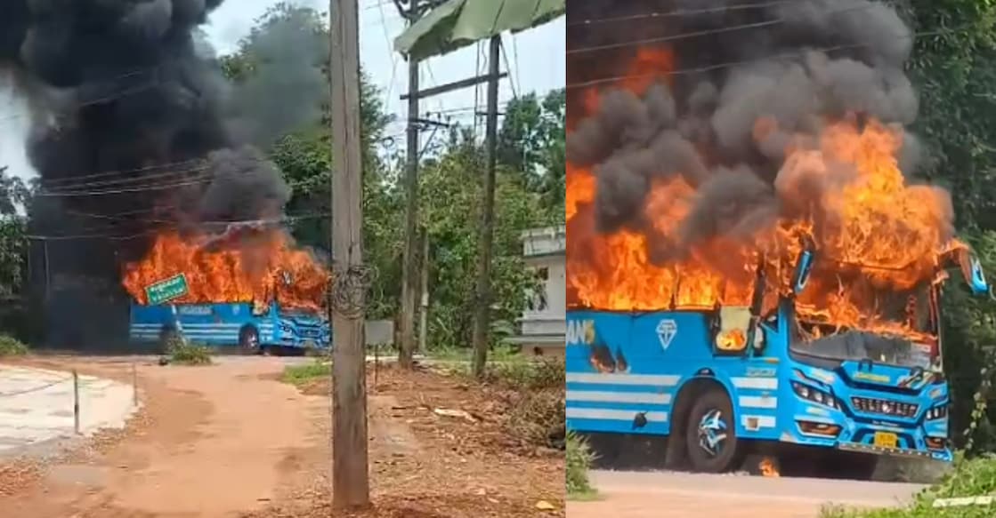 A private passenger bus caught fire while moving on the Taliparamba-Iritty state highway. Photo: Special Arrangement.