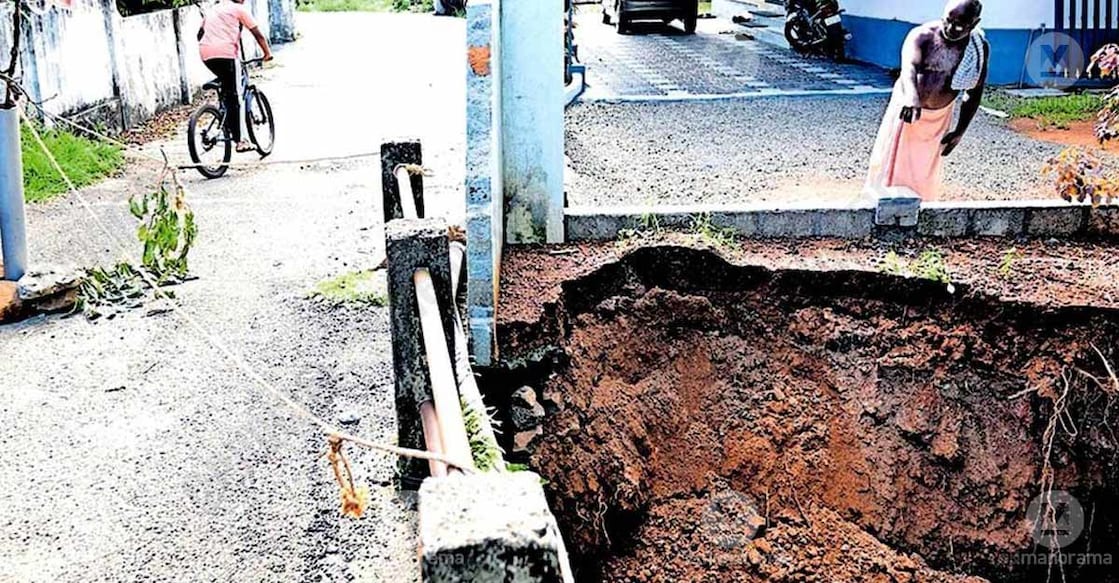 The compound wall of a house collapsed onto the bridge. Photo: Special arrangement