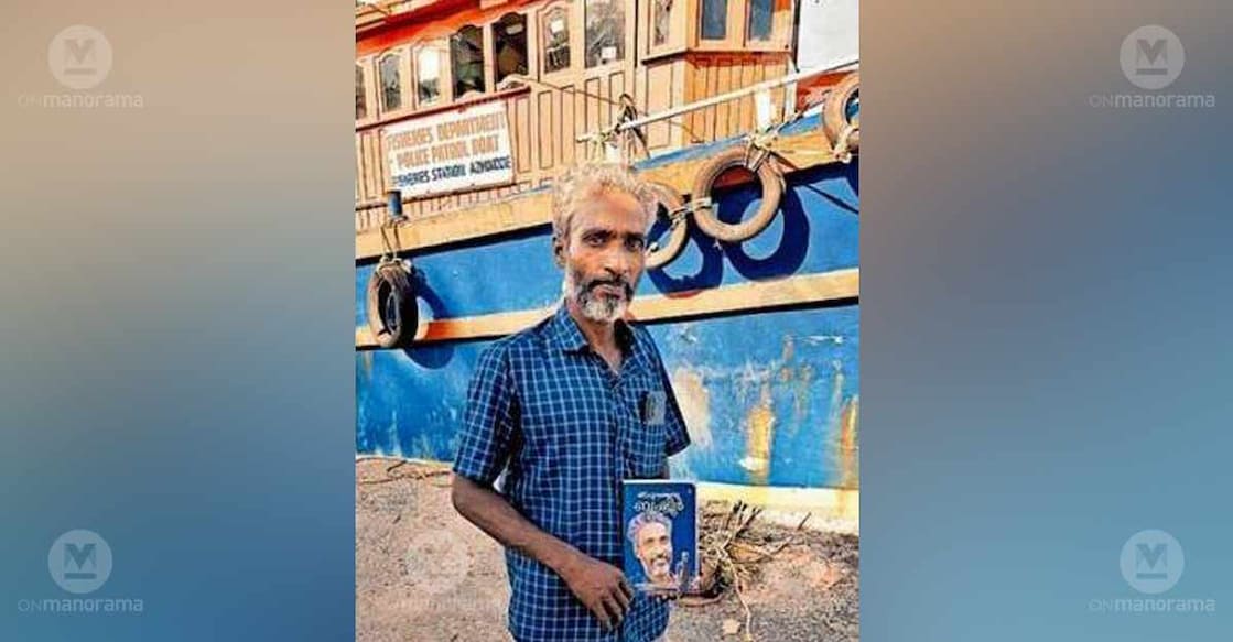 Fisherman Basheer Chavakkad at the Munakkakadavu Fish Landing Centre with his book. Photo: Special arrangement