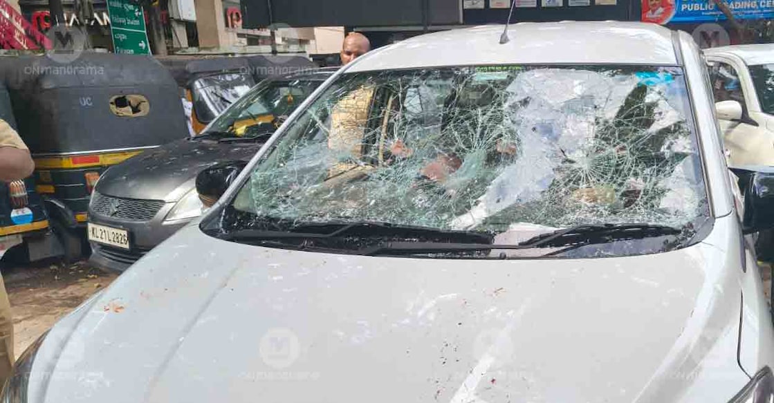Car damaged in attack by protesters against ED officials. Photo: Manorama