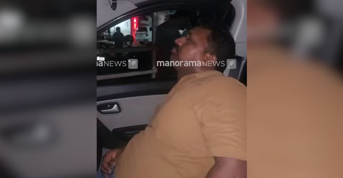 Visuals of the accident captured by locals, showing Sreekumar (37) unconscious in the vehicle. Photo: Screengrab/ Manorama News