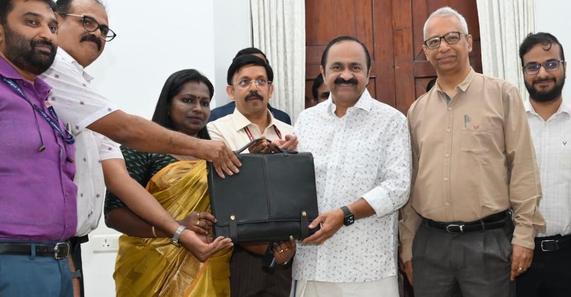 Chief Minister V D Satheesan receives the Budget bag from officials of the Printing Department. Additional Chief Secretary (Finance) K R Jyothilal, Chief Secretary A Jayathilak and other officials are seen nearby. Photo: Manorama