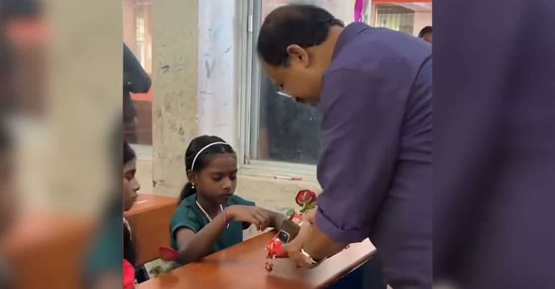BJP MLA V Muraleedharan distributing sweets to the students at the Kattela Model Residential School. Photo: Manorama News