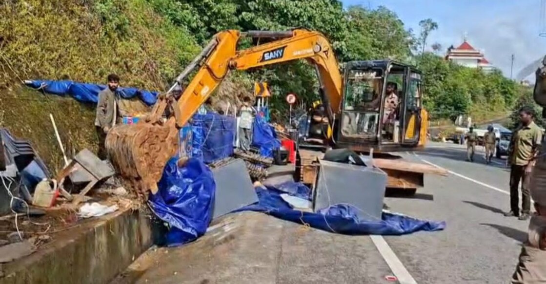 Commercial establishments built by encroaching on the roadside near the Munnar Botanical Garden being demolished by authorities. Photo: Special arrangement