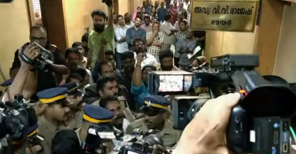 Protestors block the Mayor's office demanding Sugathan's removal.. Photo: Manorama News