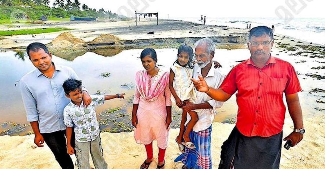 Bincy, her children Jeff and Janvi, who were swept into the sea, with their rescuers Bony, Ponnappan and Jackson at the shore of Muthalapozhi. Photo: Special arrangement