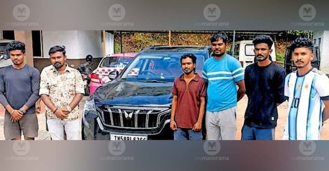 A group of Tamil Nadu tourists after being caught by police for performing a dangerous stunt on a moving vehicle on Gap Road in Munnar. Photo: Special arrangement