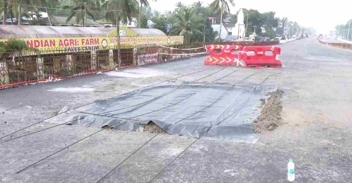 A sinkhole on the National Highway at Cherthala was filled using a concrete mixture. Photo: Manorama News 