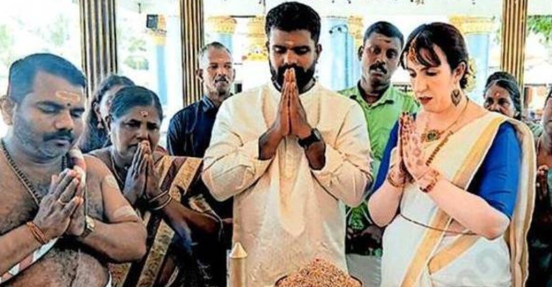 Nidhin Jith of Chellanam and Leanne Maria from the United Kingdom after their wedding at the Kalavamkodam Saktheeswaram Temple in Cherthala. Photo: Special Arrangement
