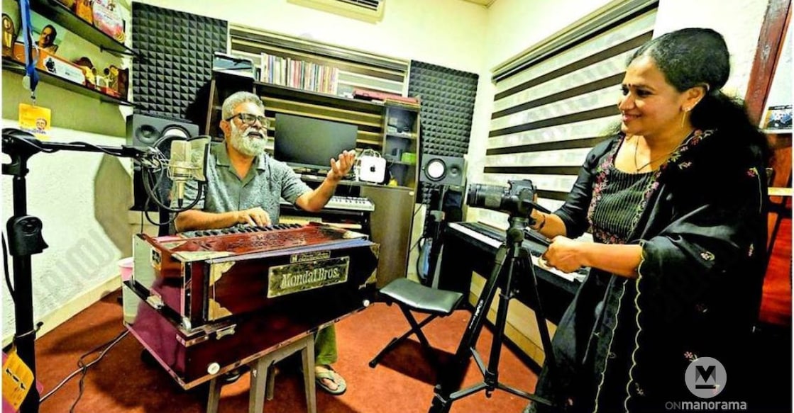 Sibichan is singing while his wife, Sini, is filming the video at the studio in the house named 'Kilikkoodu' at Thanthode, Iritty. Photo: Special Arrangement
