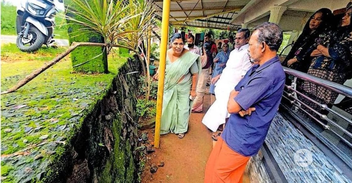 Vazhathope panchayat president Ancy Thomas inspects the courtyard of a house in Maniyarankudy where residents reported hearing an unusual underground sound. Photo: Special Arrangement