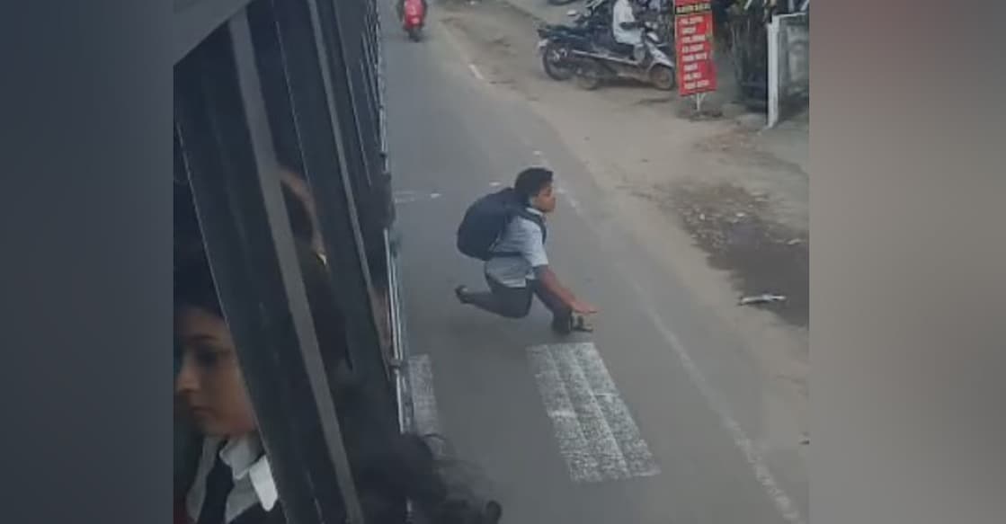 School boy falling off moving bus at Cherai. Photo: CCTV screengrab
