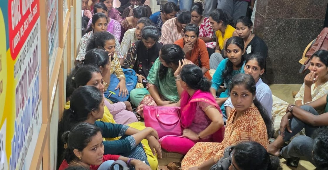Nurses stage a sit-in protest at Koyili Hospital in Kannur on Wednesday, after the management refused to sign the wage settlement accepted by five other private hospitals. Photo: Special arrangement