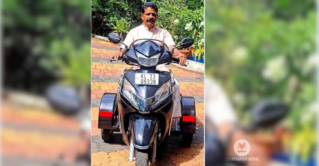 V J Philip of Thottakkad, who is battling official hurdles to get his specially-modified car certified, on his three-wheeler scooter. Photo: Special Arrangement
